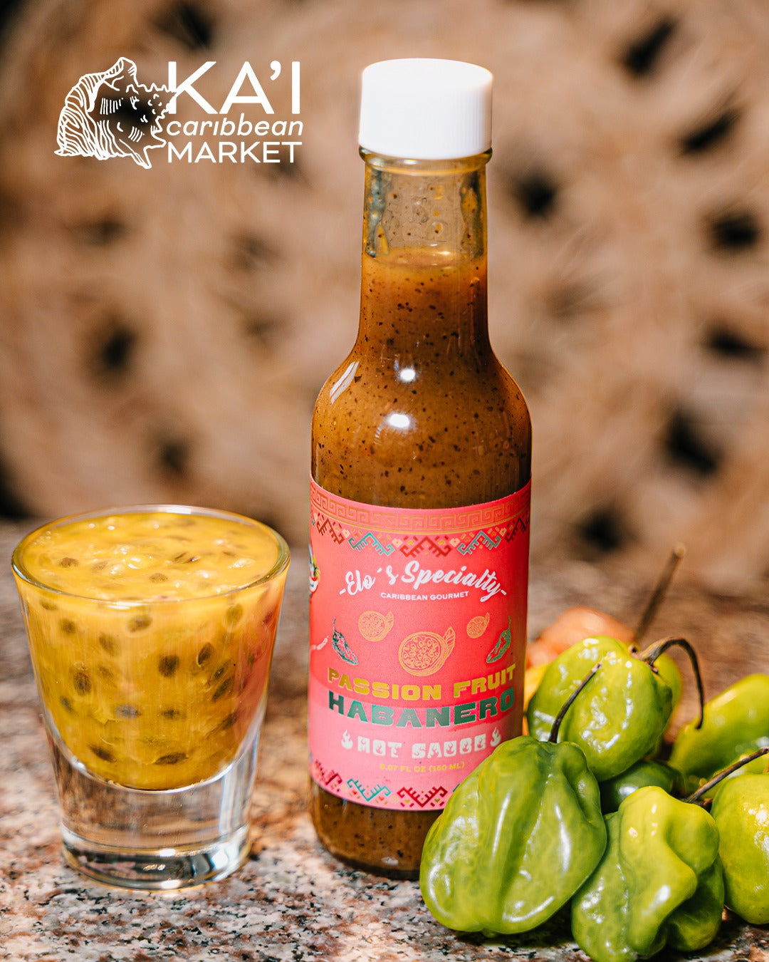 Passion Fruit Habanero hot sauce bottle with fresh habanero peppers and passion fruit pulp