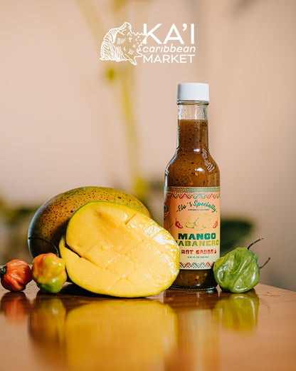 Kai Caribbean Market Mango Habanero hot sauce bottle with fresh mango and habanero peppers