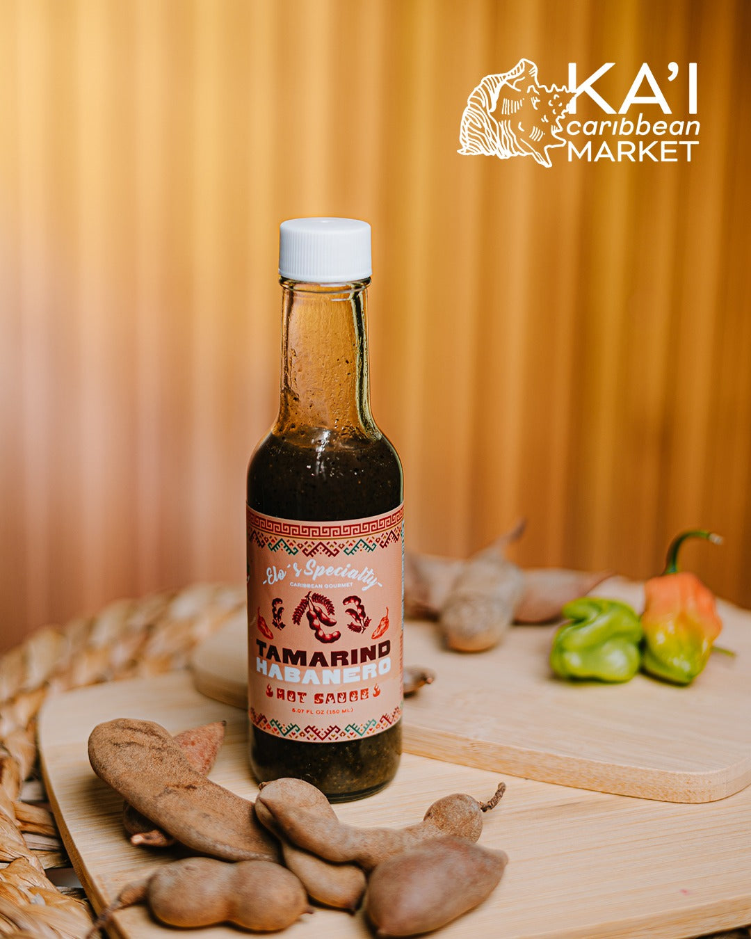 Kai Caribbean Market Tamarind Habanero hot sauce bottle with whole tamarind pods and habanero peppers